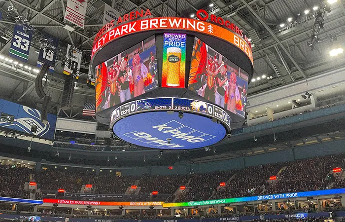 Hockey rink with branded rink board advertising in a Canadian community arena