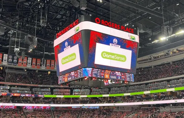 Hockey rink with branded rink board advertising in a Canadian community arena