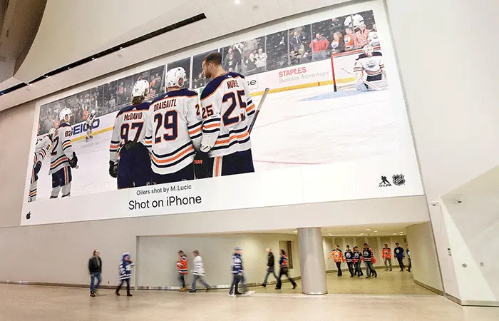 Hockey rink with branded rink board advertising in a Canadian community arena