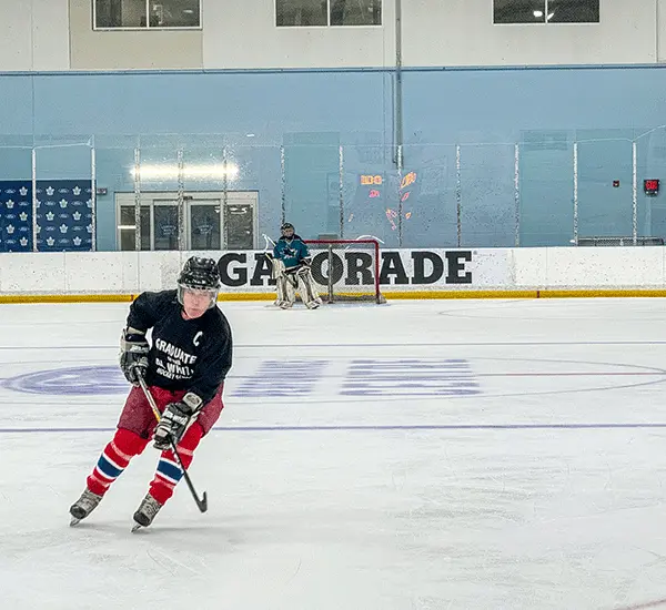 Hockey rink with branded rink board advertising in a Canadian community arena